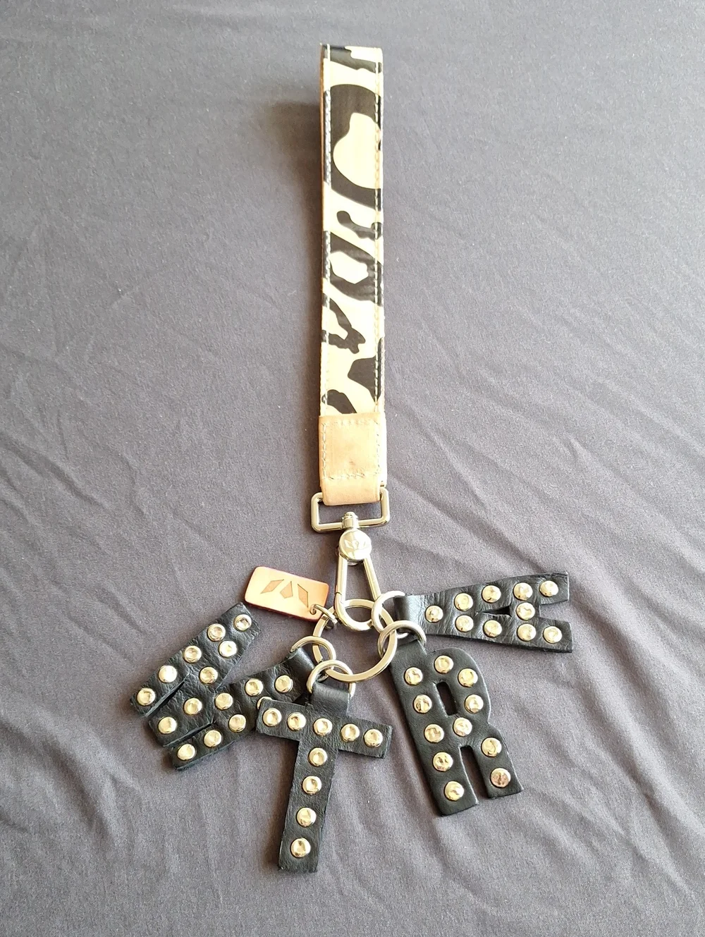 Consuela MTRA Black Studded Letter Bag Charm with Wrist Strap